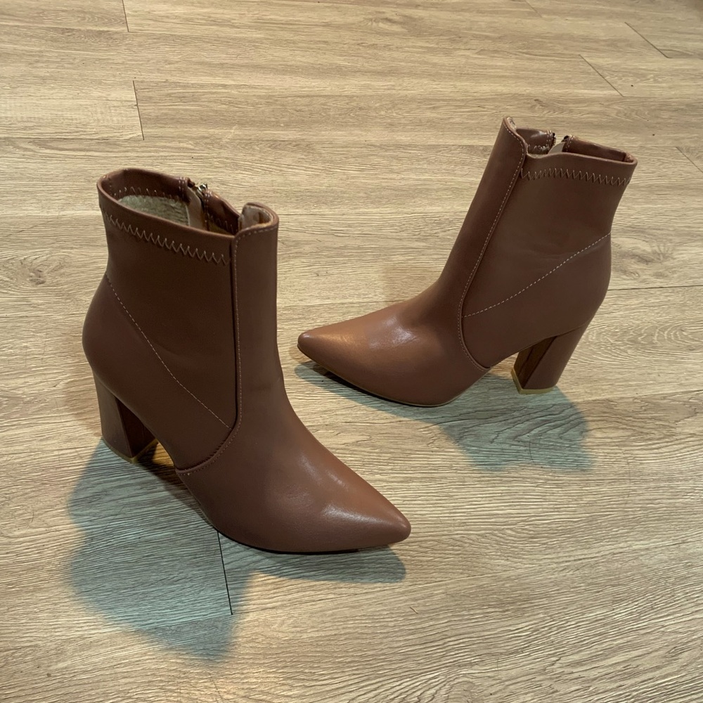 Brown heeled ankle booties. Size: 7.5